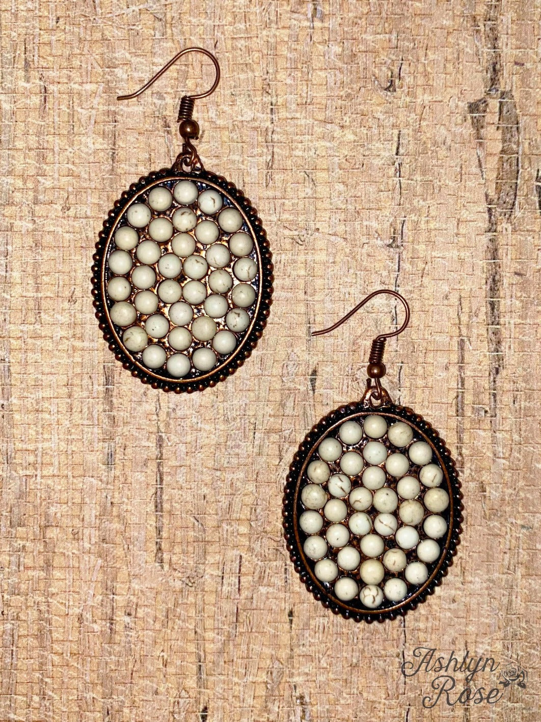 Bumpily Bamboozled Bronze Earrings With Cream Pendant